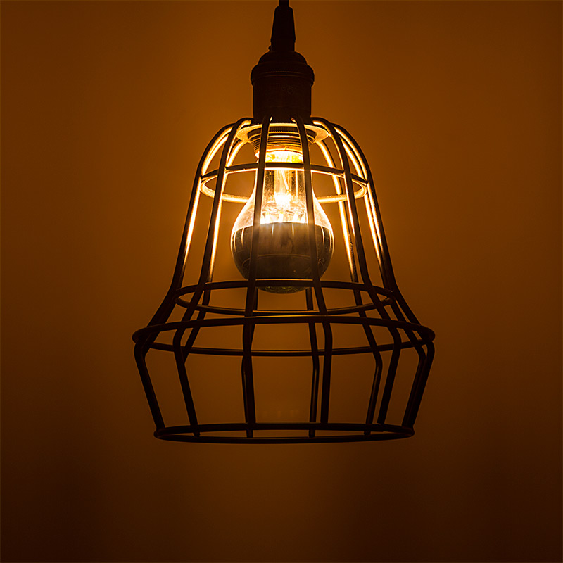 LED restaurant lighting - silver tip bulb above table