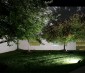 100 Watt LED Flood Light Fixture - 5000K/4000K - 250 Watt MH Equivalent - 12,000 Lumens: Illuminating Trees of Office Building (Side Angle)