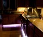 RGB LED strips installed under cabinets (near floor) for color accent 