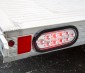 Oval LED Truck Lights and Trailer Lights with Clear Lens - 6” LED Brake/Turn/Tail Lights w/ 10 High Flux LEDs - 3-Pin Connector: Turned On Installed in Trailer