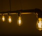 LED Vintage Light Bulb - Gold Tint ST18 Shape - Edison Style Antique Bulb with Filament LED - Dimmable: Shown Installed In Vintage Pipe Fixture. 