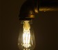 LED Vintage Light Bulb - Gold Tint ST18 Shape - Edison Style Antique Bulb with Filament LED - Dimmable: Shown In Vintage Pipe Fixture. 