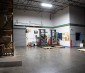Single Fixture Illuminating Warehouse Station (Side View)