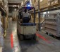 Project a bright red or blue light on the floor to alert pedestrians of forklift traffic
