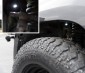 Waterproof Off Road LED Rock Light Replacement: Shown Mounted Using Flat Gasket In Wheel well. 