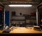 T8 LED Vapor Proof Light Fixture for 2 LED T8 Tubes - Industrial LED Light - 4' Long: Shown Installed Over Work Bench With Warm White T8 Tubes (Sold Separately).